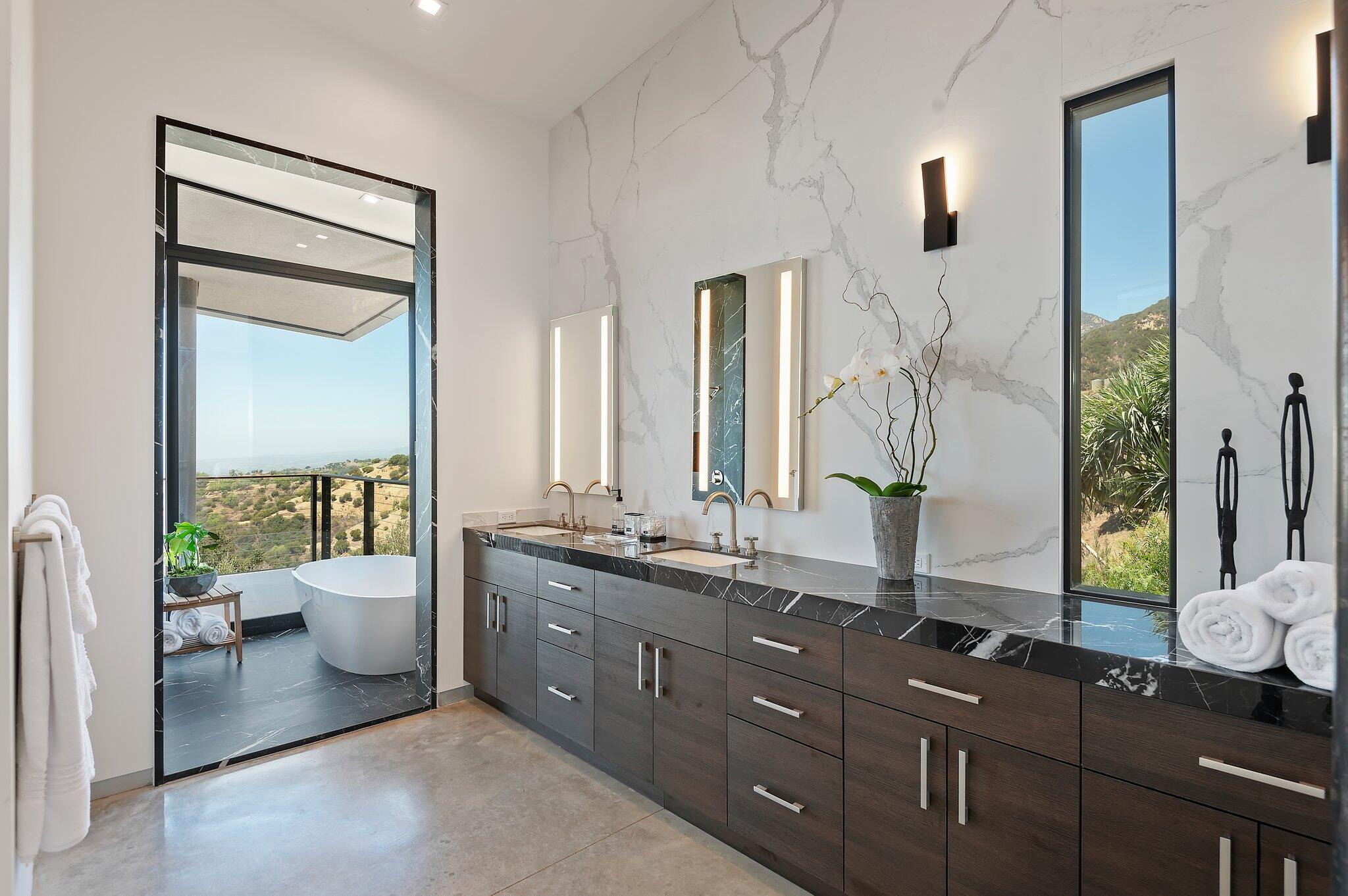 2805 Spyglass Ridge Road Santa Barbara, CA 93105 - Photo 37 of 67 a bathroom with a double vanity sink toilet and a mirror