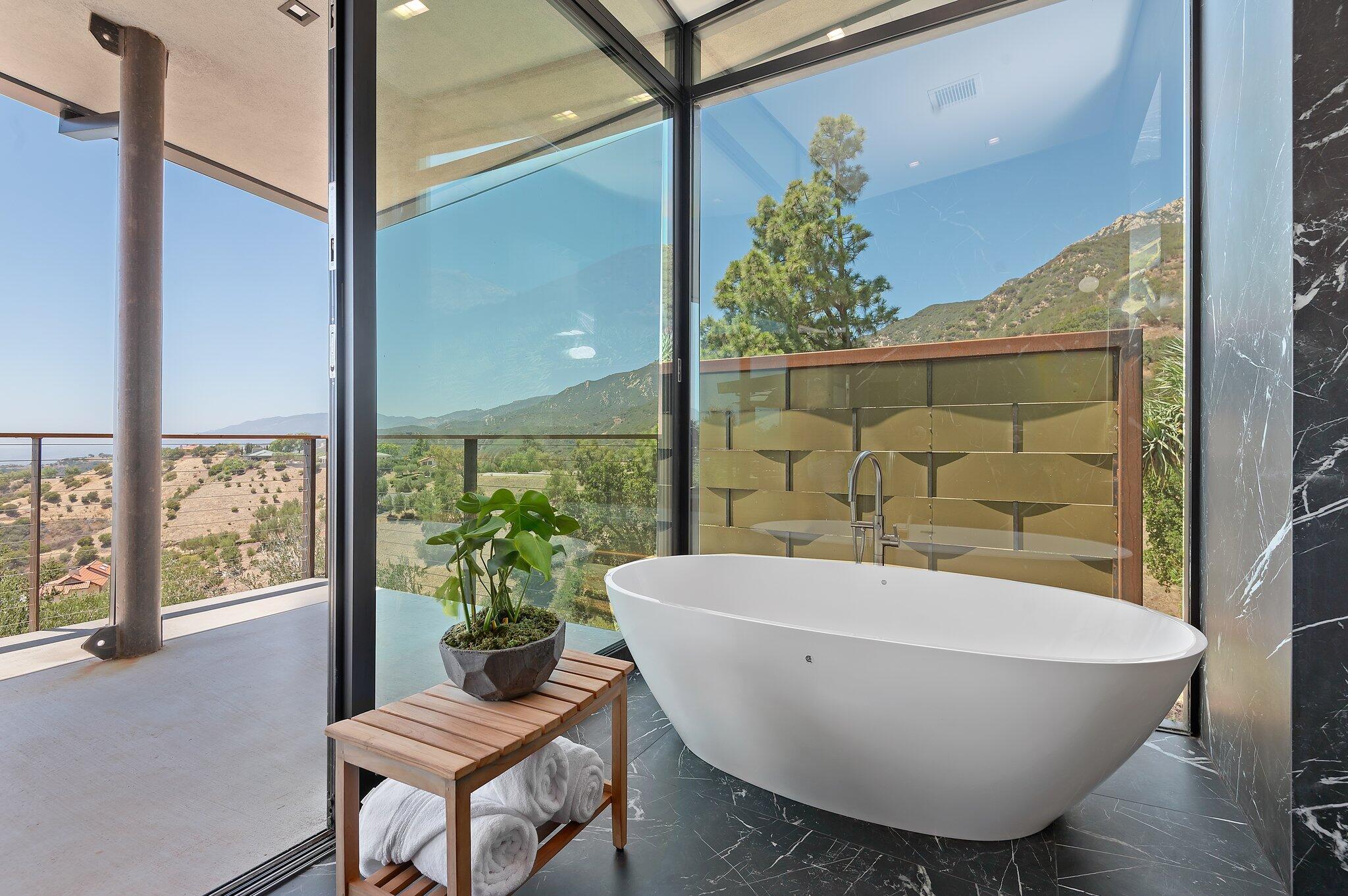2805 Spyglass Ridge Road Santa Barbara, CA 93105 - Photo 38 of 67 a white bath tub sitting in a bathroom next to a window