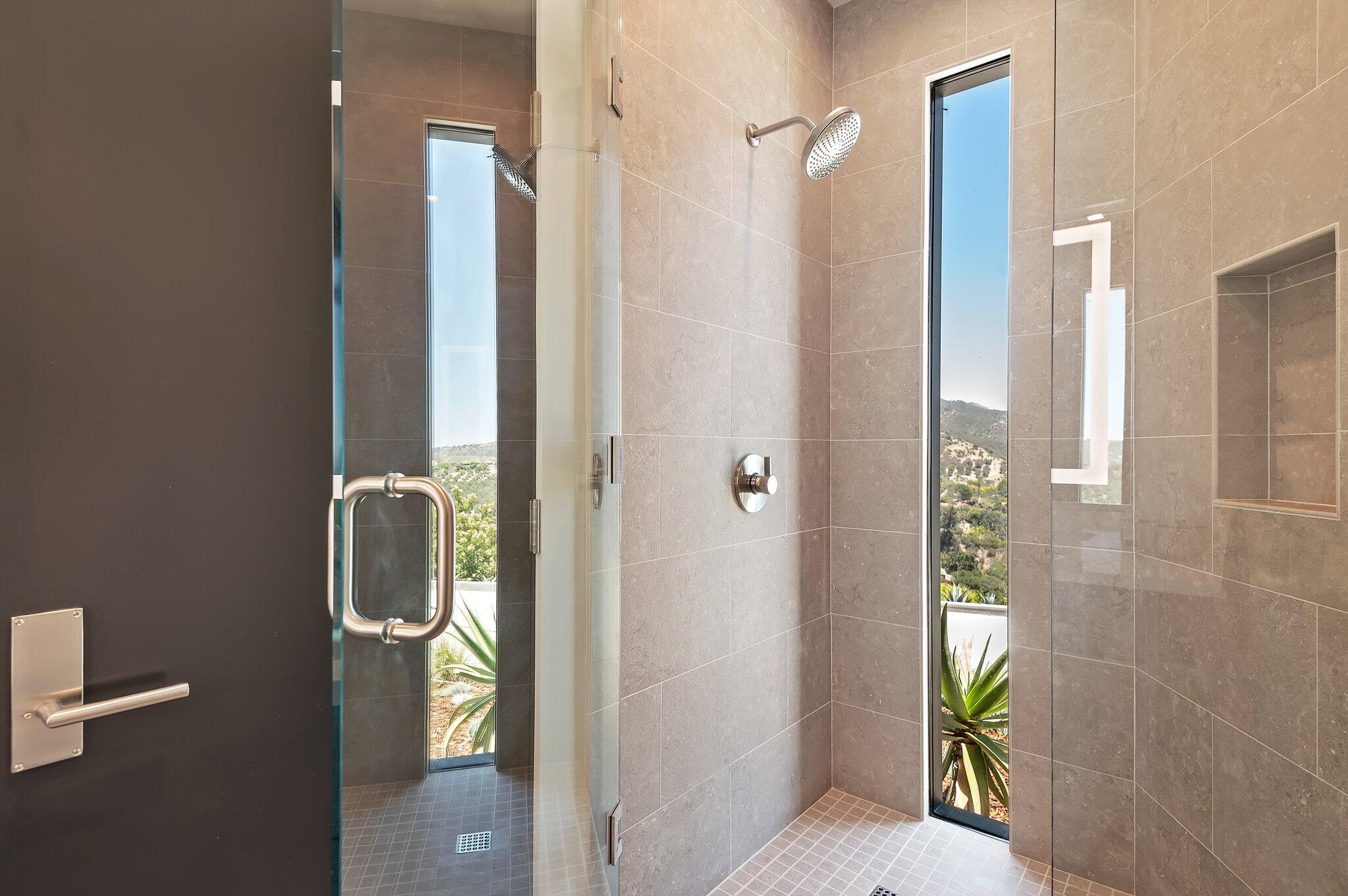 2805 Spyglass Ridge Road Santa Barbara, CA 93105 - Photo 43 of 67 a bathroom with a shower and a glass door