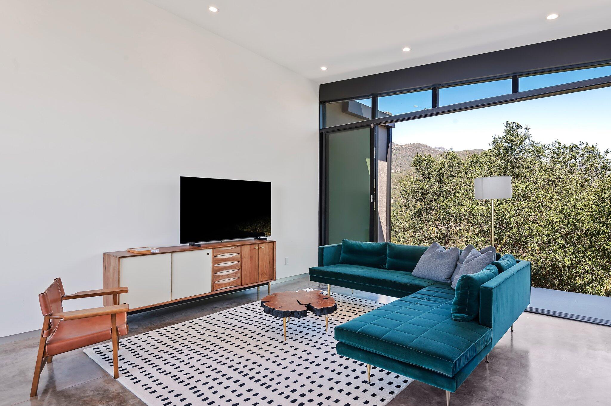 2805 Spyglass Ridge Road Santa Barbara, CA 93105 - Photo 55 of 67 a living room with furniture and a flat screen tv