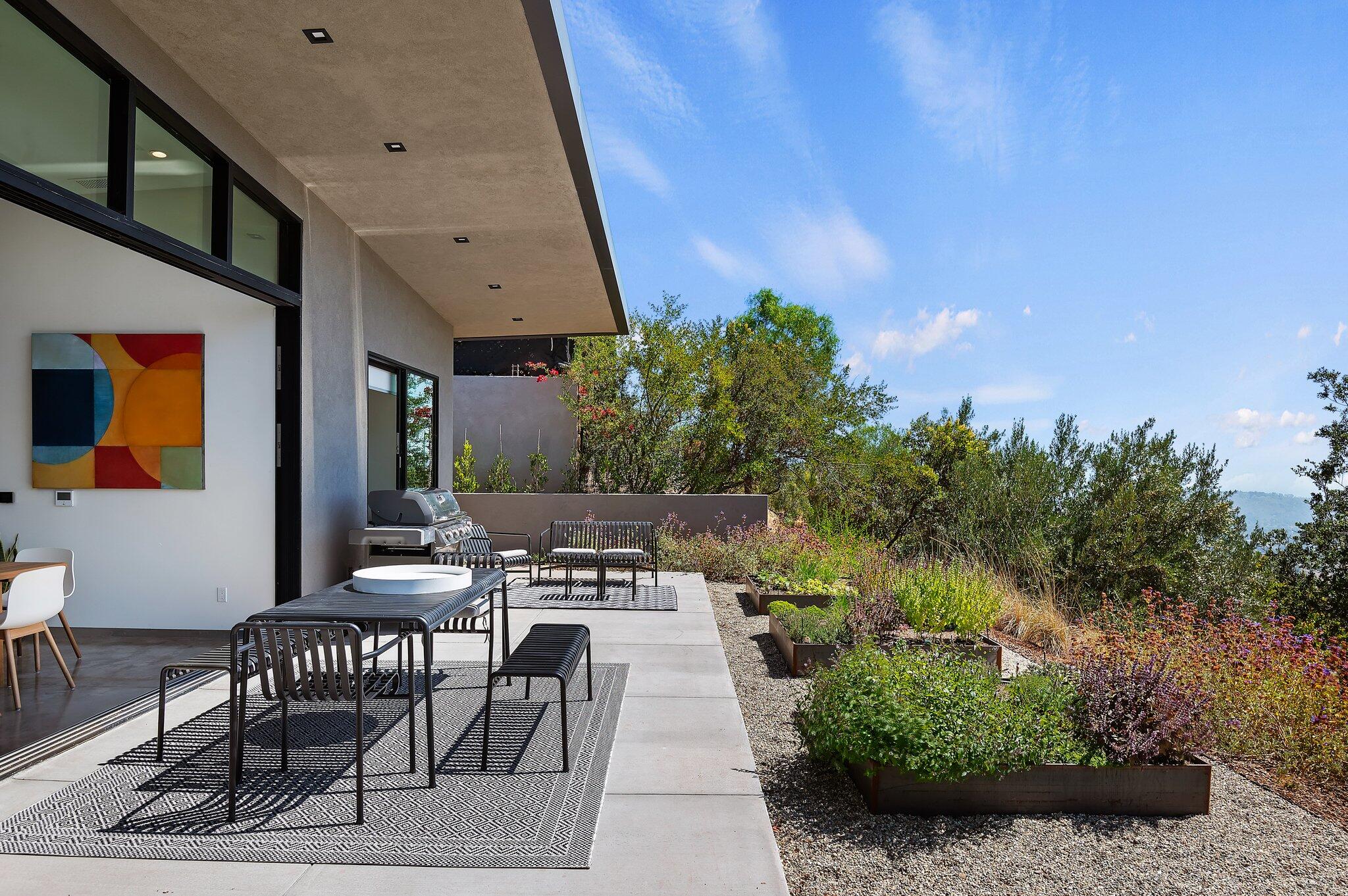 2805 Spyglass Ridge Road Santa Barbara, CA 93105 - Photo 59 of 67 a view of patio with table and chairs and potted plants