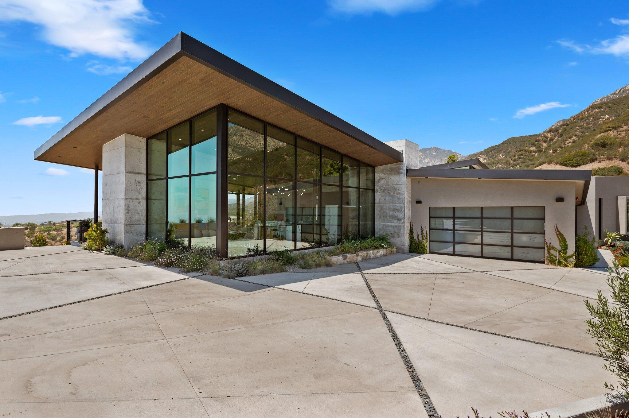 2805 Spyglass Ridge Road Santa Barbara, CA 93105 - Photo 9 of 67 a front view of a house with a yard and garage