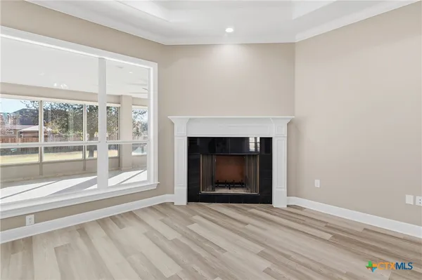 a large kitchen with stainless steel appliances granite countertop a lot of counter space and a sink