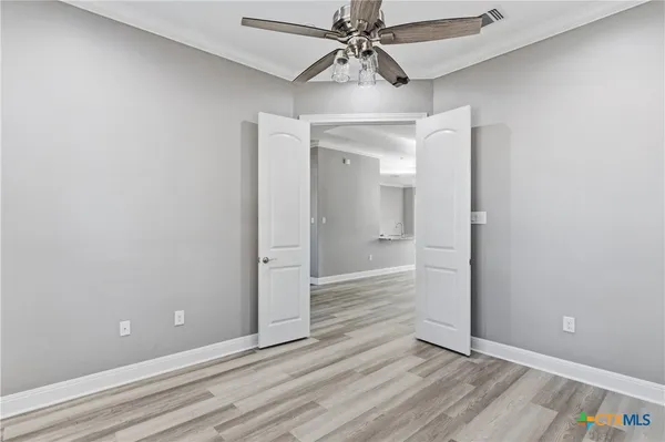 a kitchen with stainless steel appliances kitchen island granite countertop a refrigerator and a sink