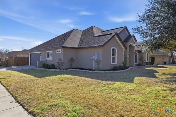 a view of kitchen with kitchen island stainless steel appliances cabinets and wooden floor