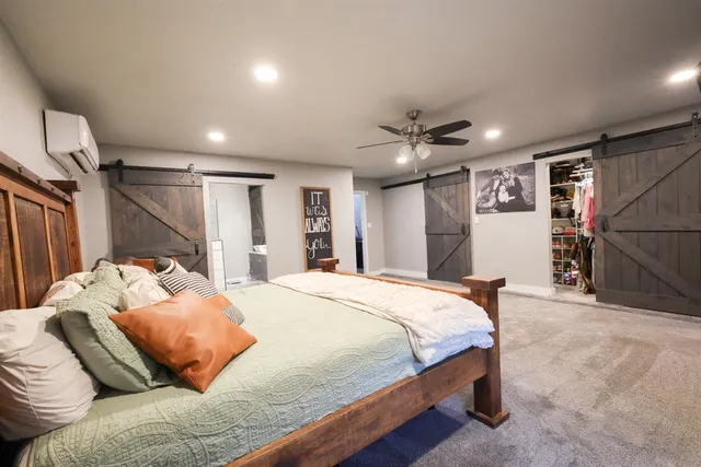 a bed room with a bed and a couch