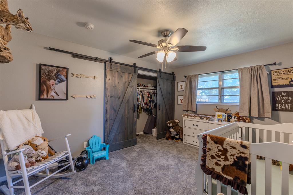 1300 Hillcrest Road Coleman, TX 76834 - Photo 20 of 35 a view of a livingroom with furniture and a ceiling fan