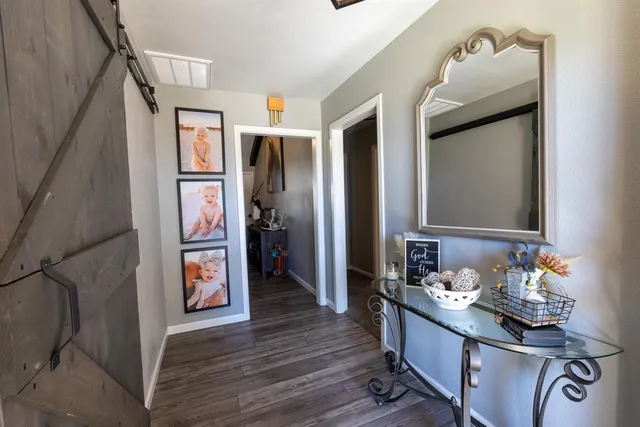 a kitchen with stainless steel appliances granite countertop a refrigerator and a stove