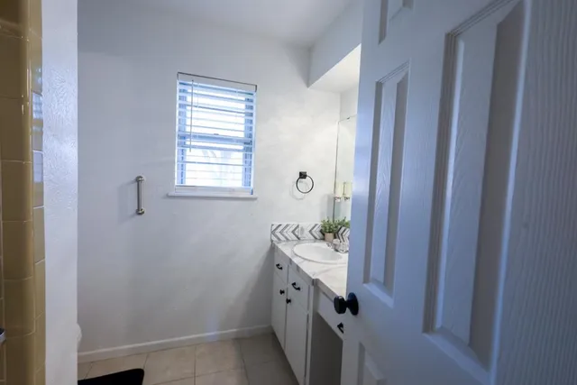 a bathroom with a sink and a mirror