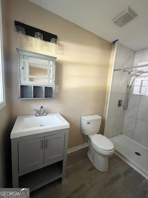 203 Vienna Circle Fort Valley, GA 31030 - Photo 15 of 22 a bathroom with a toilet a sink and mirror