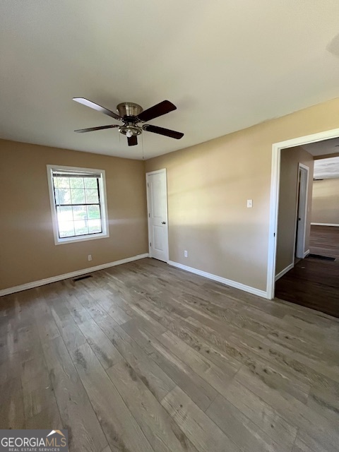 203 Vienna Circle Fort Valley, GA 31030 - Photo 16 of 22 a view of empty room with wooden floor and fan