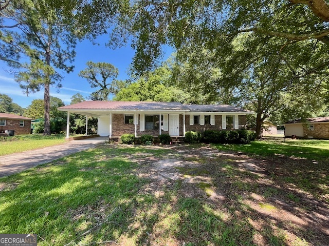 203 Vienna Circle Fort Valley, GA 31030 - Photo 2 of 22 a front view of a house with yard patio and green space