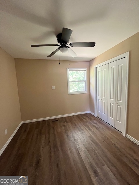 203 Vienna Circle Fort Valley, GA 31030 - Photo 22 of 22 a view of an empty room with wooden floor and a window