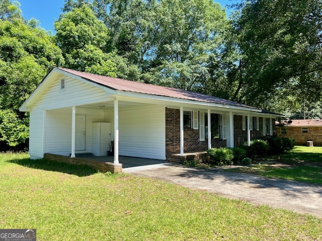 203 Vienna Circle Fort Valley, GA 31030 - Photo 3 of 22 a view of a house with backyard and garden