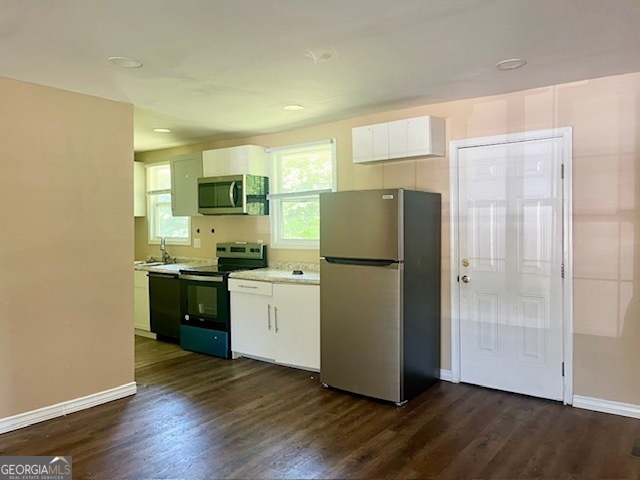 203 Vienna Circle Fort Valley, GA 31030 - Photo 6 of 22 a kitchen with a refrigerator and a stove top oven