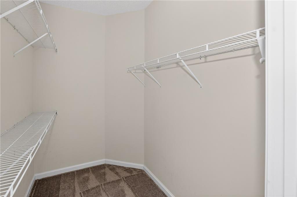 181 Windsor Circle Stockbridge, GA 30281 - Photo 14 of 49 a view of an empty walk in closet