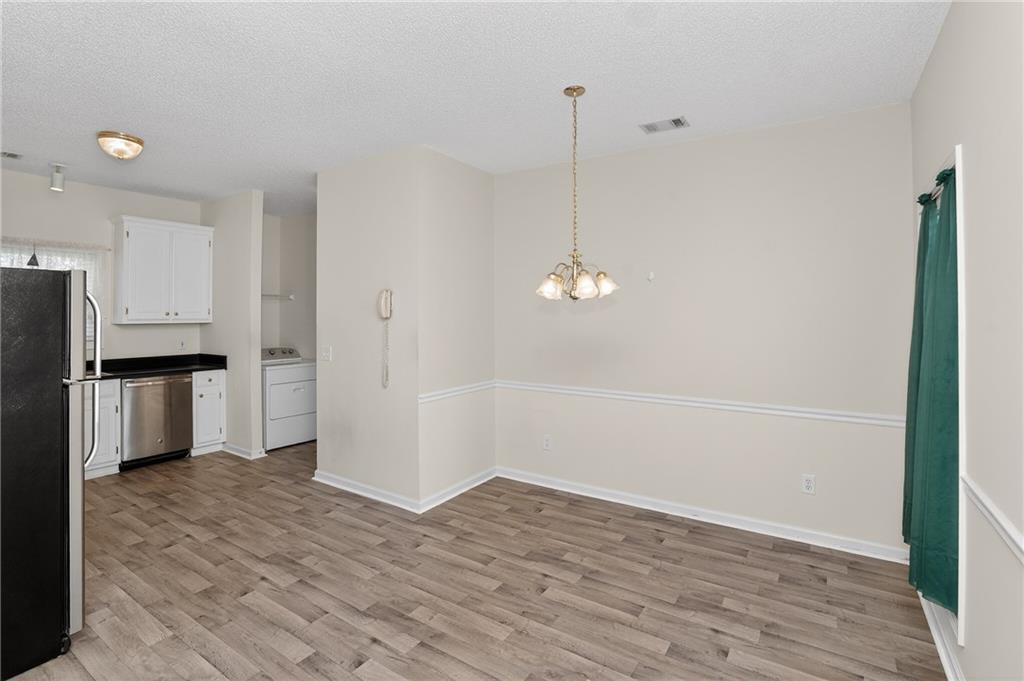 181 Windsor Circle Stockbridge, GA 30281 - Photo 19 of 49 a view of an empty room with a kitchen