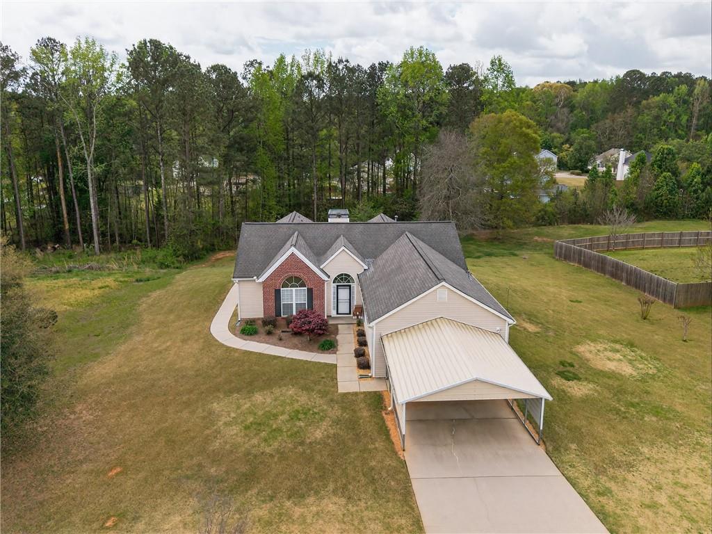181 Windsor Circle Stockbridge, GA 30281 - Photo 2 of 49 a view of a house with a yard