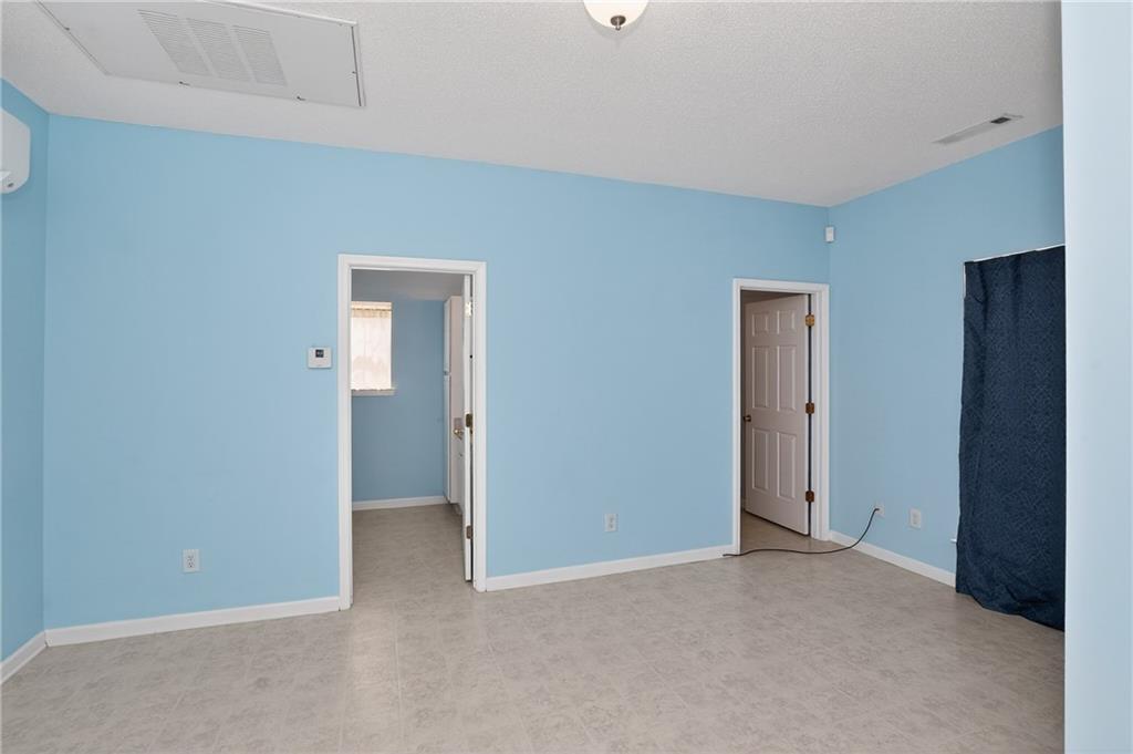 181 Windsor Circle Stockbridge, GA 30281 - Photo 32 of 49 a view of an empty room with closet and wooden floor