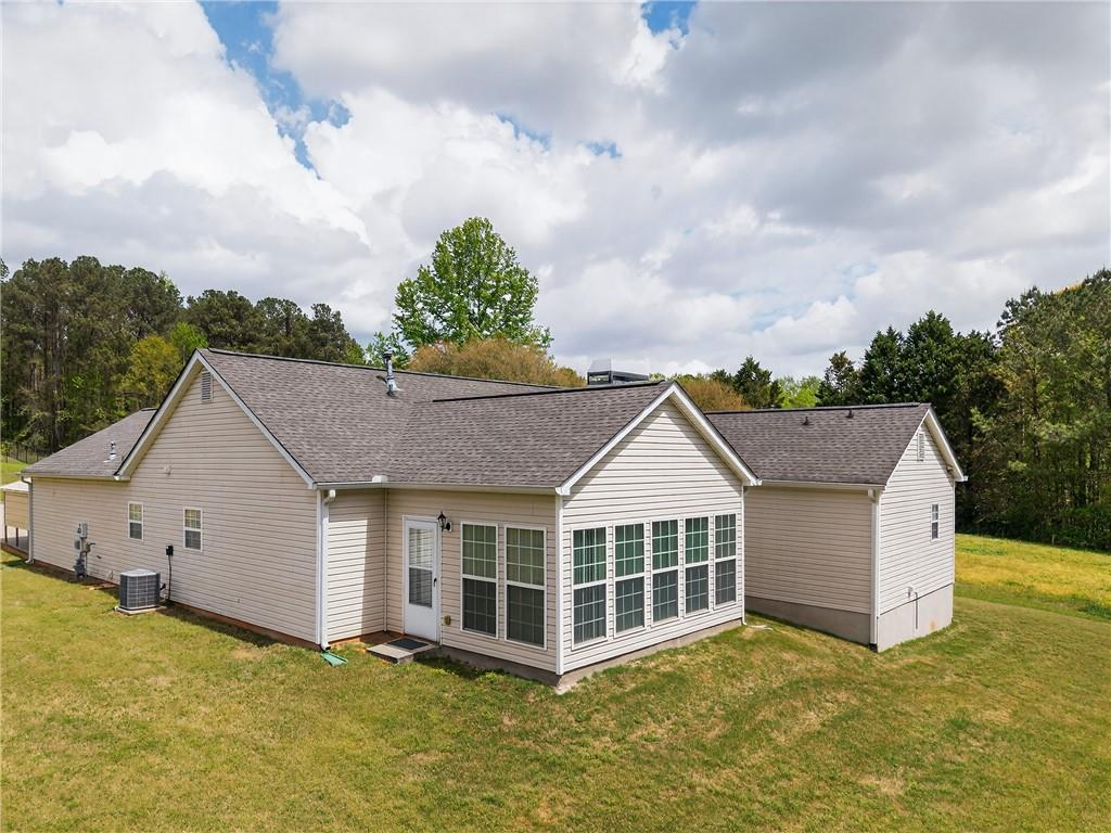 181 Windsor Circle Stockbridge, GA 30281 - Photo 41 of 49 a view of a house with a yard and potted plants