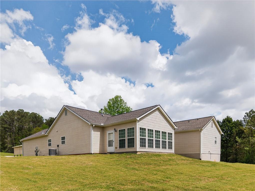 181 Windsor Circle Stockbridge, GA 30281 - Photo 42 of 49 a front view of a house with a garden