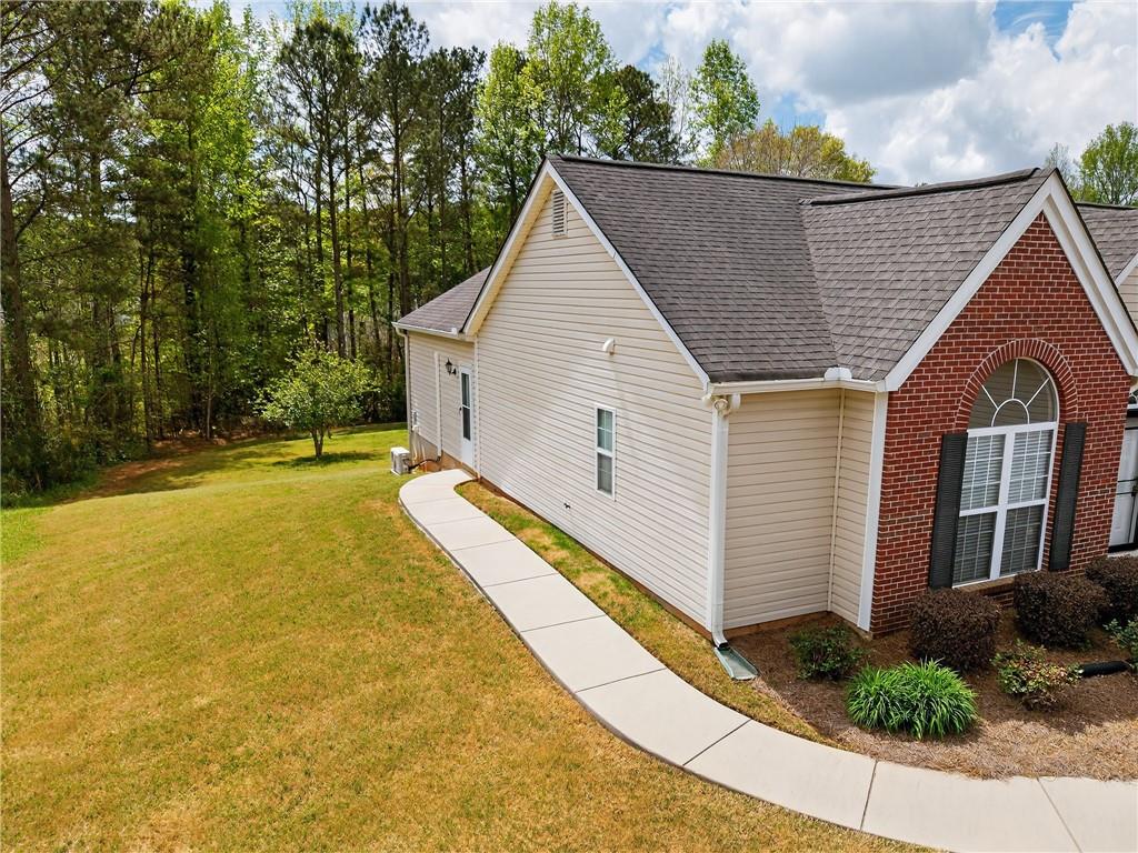181 Windsor Circle Stockbridge, GA 30281 - Photo 6 of 49 a view of house with backyard and trees in the background