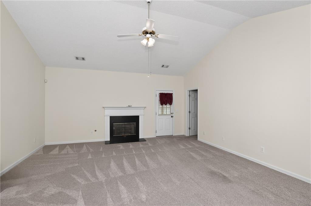 181 Windsor Circle Stockbridge, GA 30281 - Photo 9 of 49 a view of an empty room with a fireplace