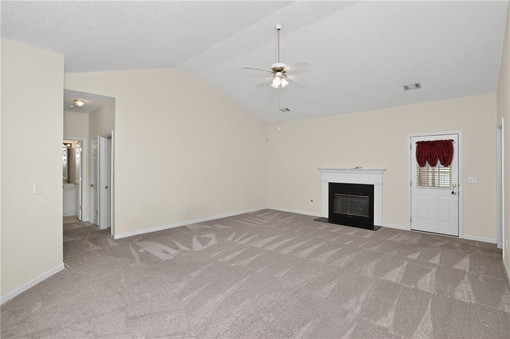 181 Windsor Circle Stockbridge, GA 30281 - Photo 10 of 49 a view of empty room with a fireplace