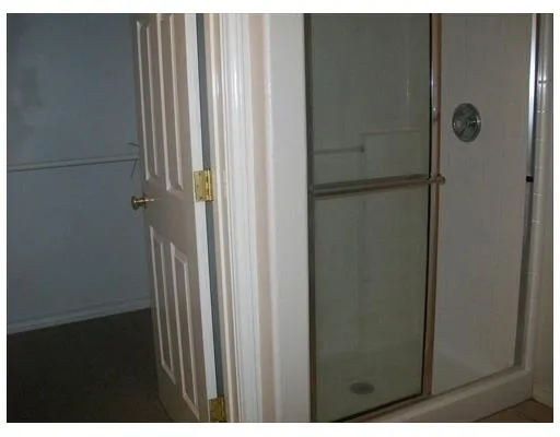 a view of a bathroom from the hallway