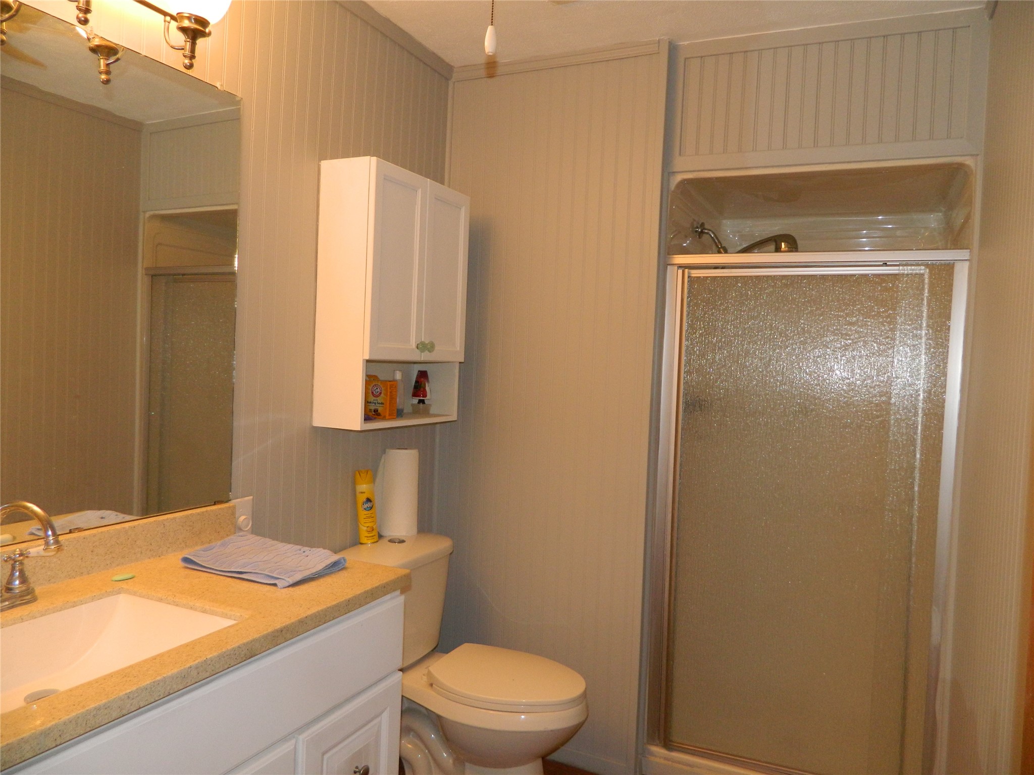 90 Cove Road Coldspring, TX 77331 - Photo 15 of 24 a bathroom with a granite countertop sink and a mirror