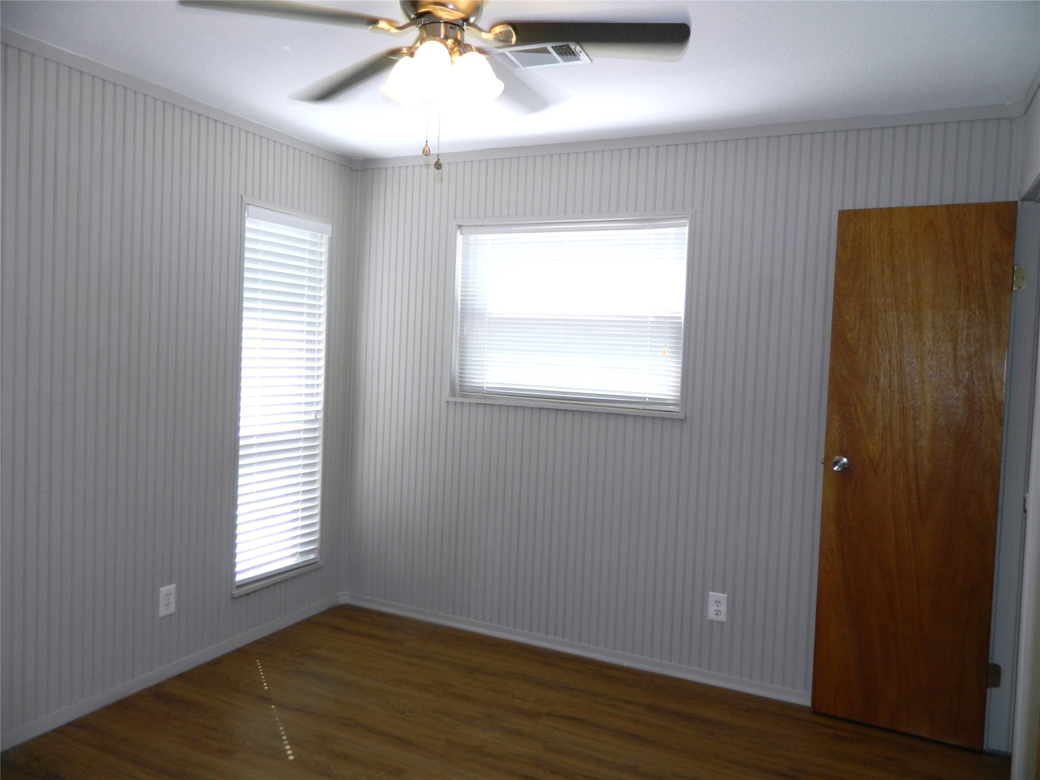 90 Cove Road Coldspring, TX 77331 - Photo 16 of 24 a view of an empty room with wooden floor and a window
