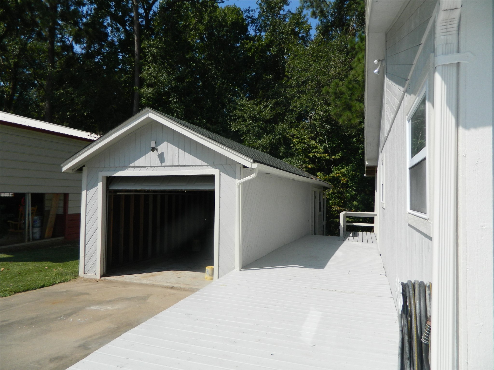 90 Cove Road Coldspring, TX 77331 - Photo 2 of 24 a front view of a house with a yard