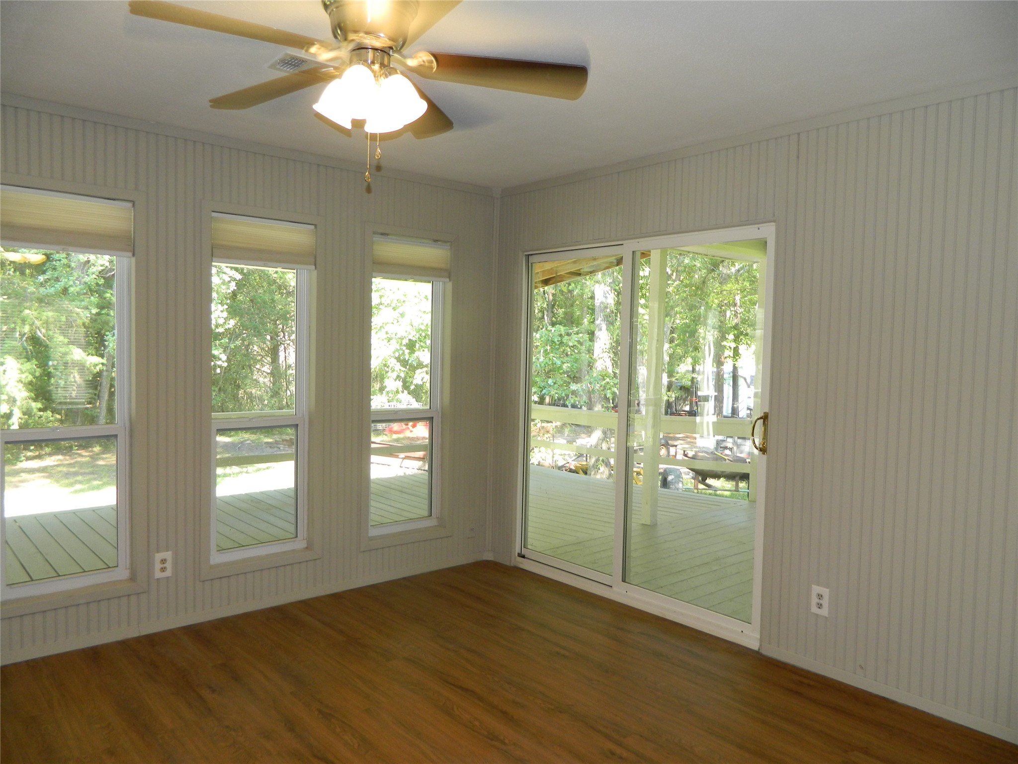 90 Cove Road Coldspring, TX 77331 - Photo 22 of 24 a view of an empty room with wooden floor and a window