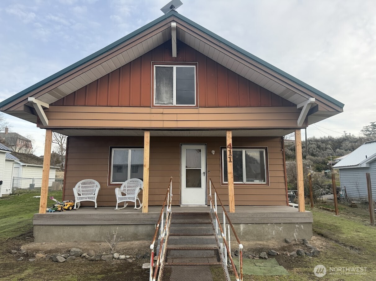 a front view of a house with garden