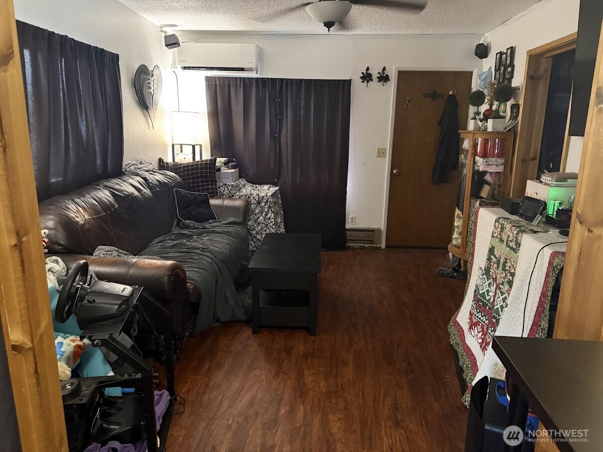 411 South Division Street Odessa, WA 99159 - Photo 13 of 20 a living room with furniture and a flat screen tv
