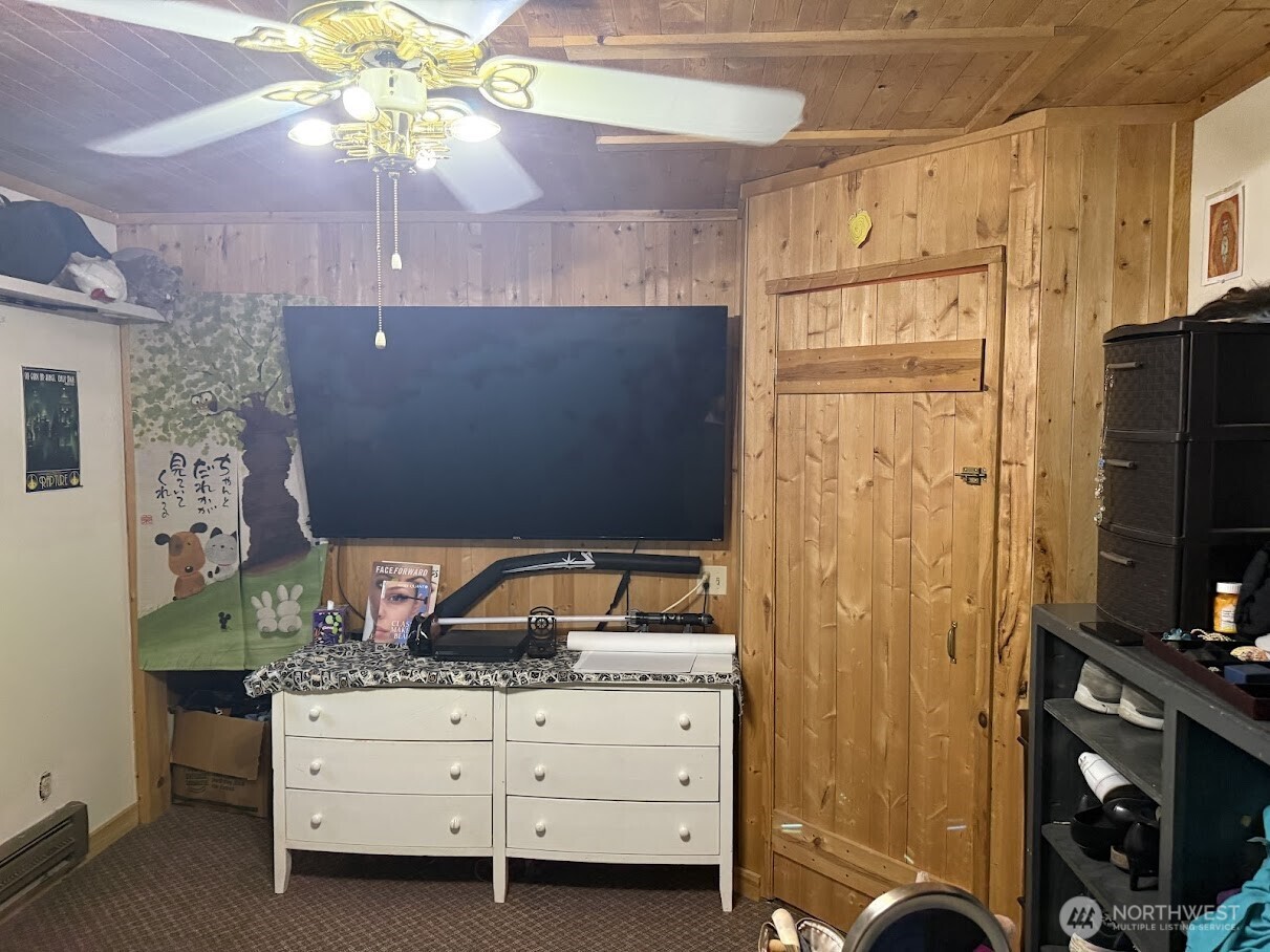 411 South Division Street Odessa, WA 99159 - Photo 16 of 20 a bedroom with a bed and a flat tv screen on the dresser