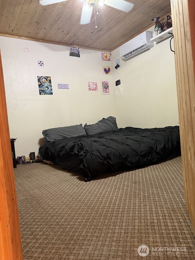 411 South Division Street Odessa, WA 99159 - Photo 17 of 20 a large bed sitting in a bedroom next to a cabinet