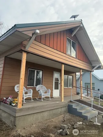 a front view of a house with a porch
