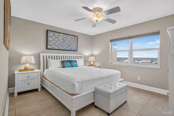 a bedroom with a bed and a television