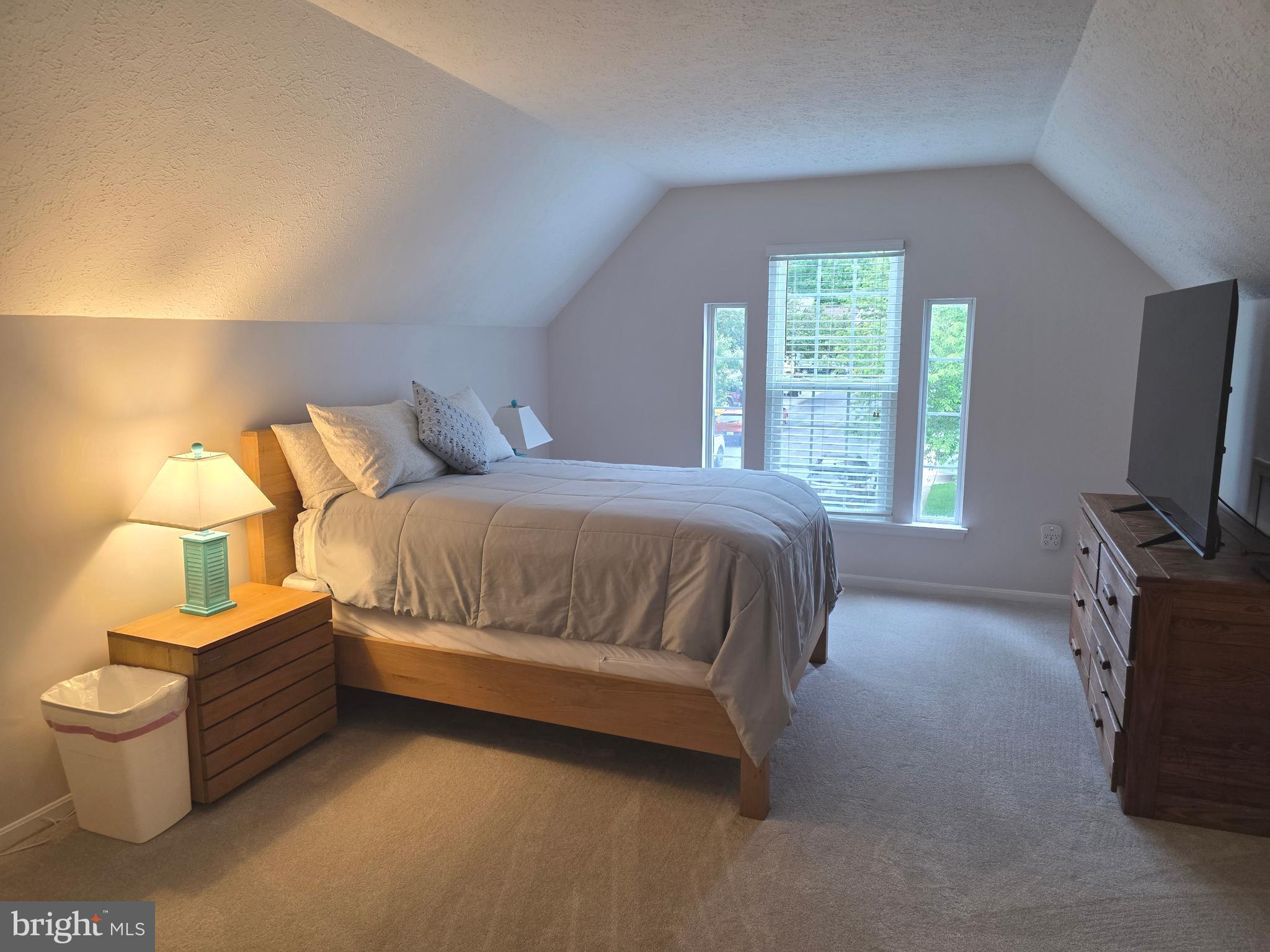 2441 Kemper Road Crofton, MD 21114 - Photo 34 of 63 a bedroom with a bed and a tv on table