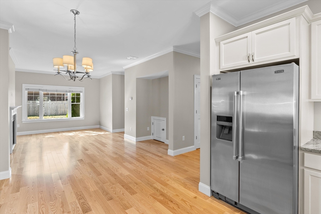 4 Emerald Way, Unit 4 Salisbury, MA 01952 - Photo 15 of 40 a view of a room with wooden floor closet and windows