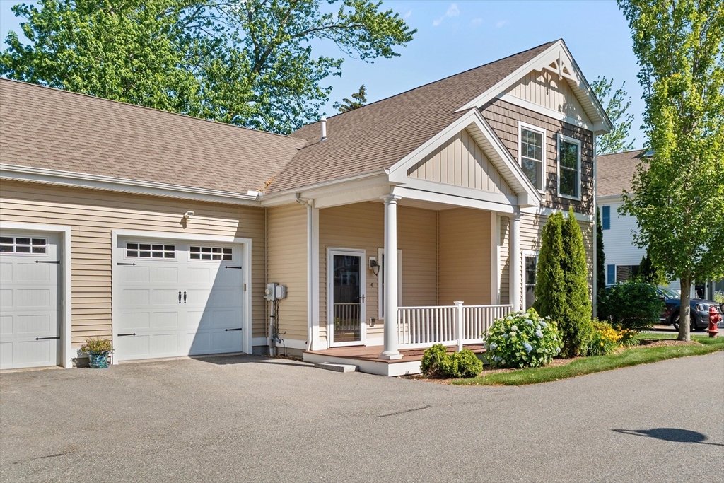 4 Emerald Way, Unit 4 Salisbury, MA 01952 - Photo 2 of 40 front view of a house with a yard