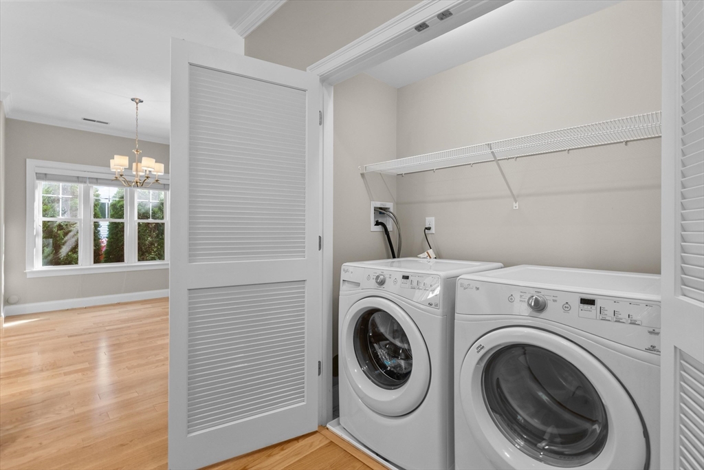 4 Emerald Way, Unit 4 Salisbury, MA 01952 - Photo 25 of 40 a view of a hallway with washer and dryer