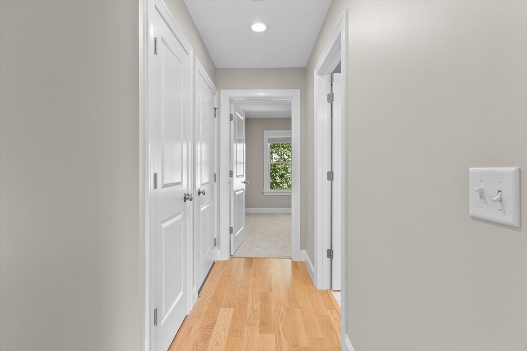 4 Emerald Way, Unit 4 Salisbury, MA 01952 - Photo 28 of 40 a view of a hallway with wooden floor