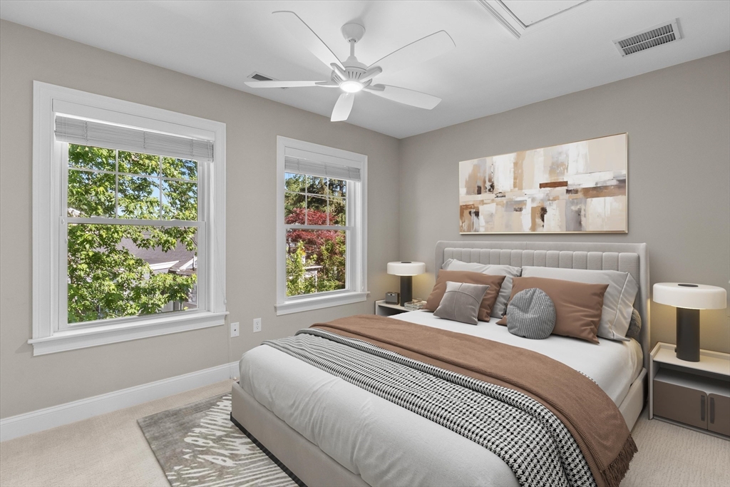 4 Emerald Way, Unit 4 Salisbury, MA 01952 - Photo 32 of 40 a bedroom with a large bed and a window