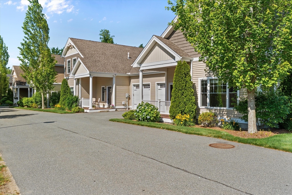 4 Emerald Way, Unit 4 Salisbury, MA 01952 - Photo 38 of 40 front view of house with a yard