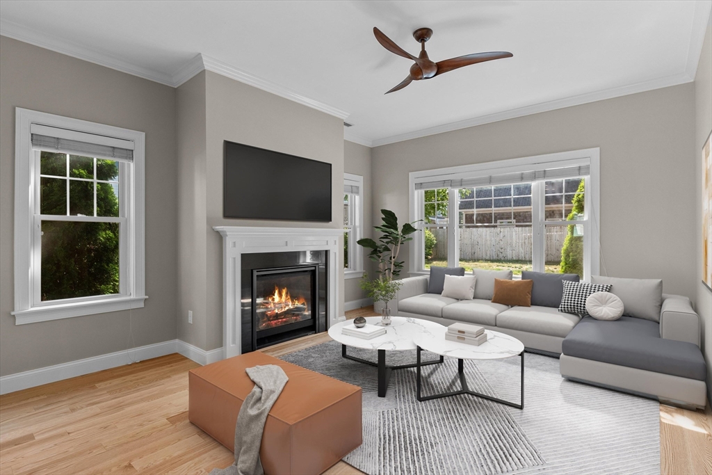 4 Emerald Way, Unit 4 Salisbury, MA 01952 - Photo 7 of 40 a living room with furniture a fireplace and a flat screen tv