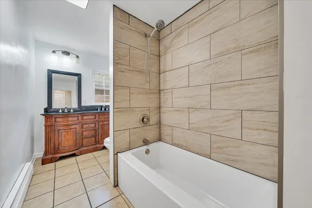 a bathroom with a bathtub and a sink