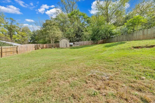 a backyard of a house with lots of green space