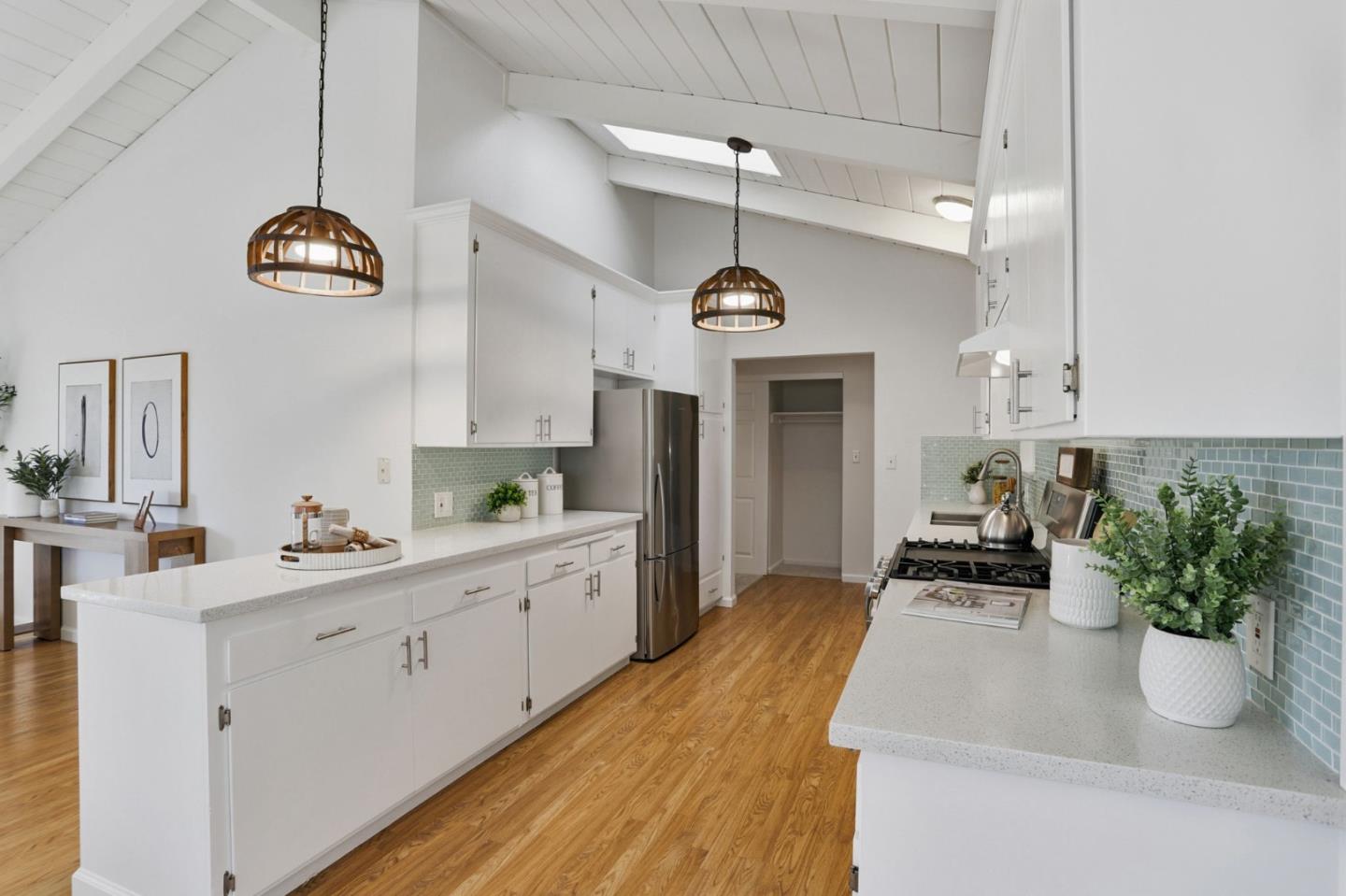 2119 Burr Court Santa Cruz, CA 95062 - Photo 14 of 38 a kitchen with a white cabinets and chandelier